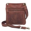 Concealed Carry Crossbody Flat Sac in vintage tanned distressed buffalo leather with adjustable shoulder strap, front zipper pocket, and metal hardware details, shown against a white background.